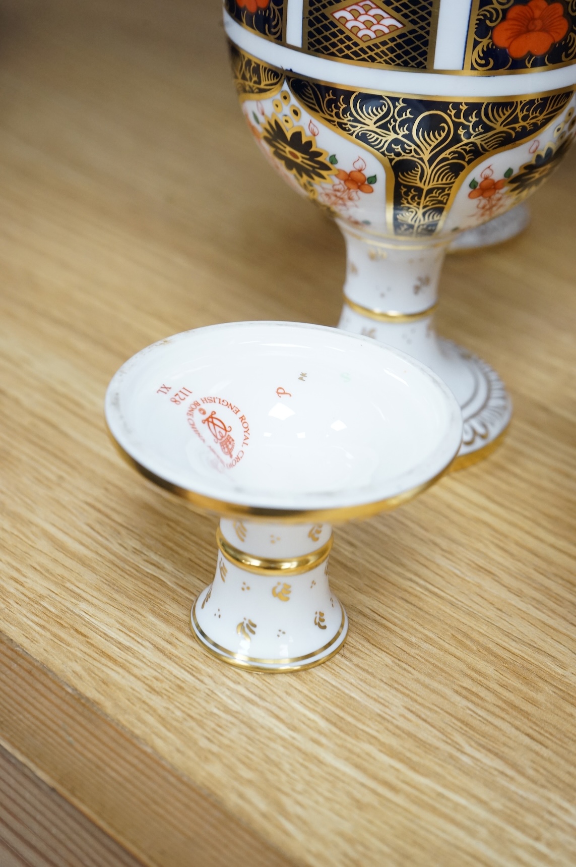 A group of six Royal Crown Derby stemmed cups (one cup and stem detached). 12.5cm high